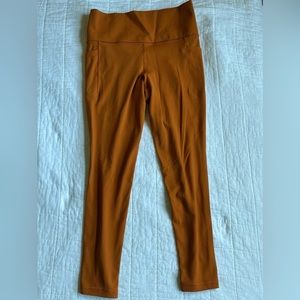 Athleta salutation stash tight